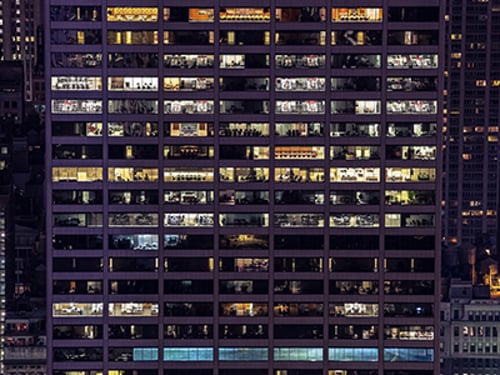 Office building with illuminated windows.